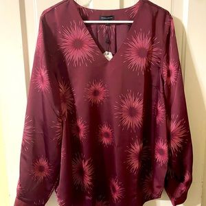 Universal Standard long sleeve satin blouse.